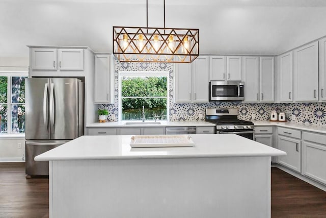 1008 Twin Terrace Ct, Round Rock, TX 78665 - kitchen featuring stainless steel appliances, a sink, dark wood finished floors, and light countertops