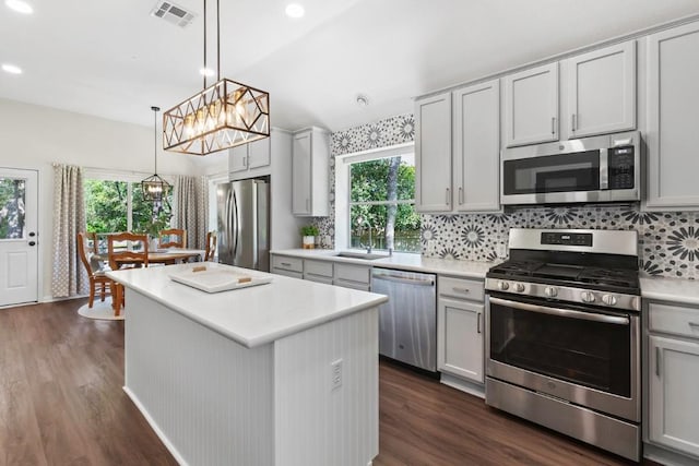 1008 Twin Terrace Ct, Round Rock, TX 78665 - kitchen with appliances with stainless steel finishes, a sink, dark wood finished floors, healthy amount of natural light, and recessed lighting