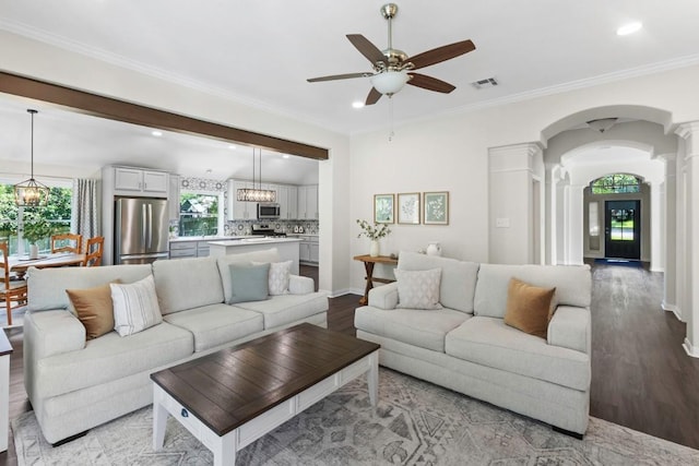 1008 Twin Terrace Ct, Round Rock, TX 78665 - living room featuring ornate columns, ceiling fan, wood finished floors, arched walkways, and recessed lighting