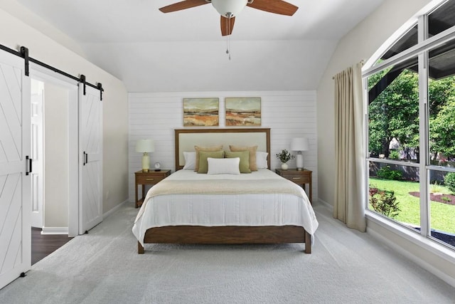 1008 Twin Terrace Ct, Round Rock, TX 78665 - carpeted bedroom with a barn door, vaulted ceiling, a ceiling fan, and baseboards