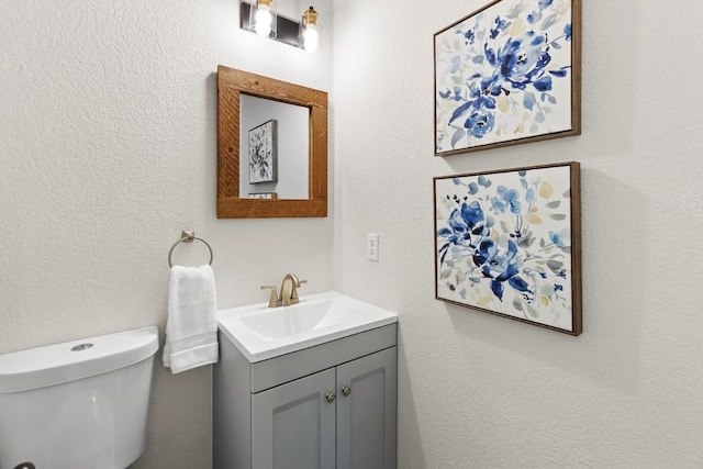 1008 Twin Terrace Ct, Round Rock, TX 78665 - bathroom featuring vanity, toilet, and a textured wall