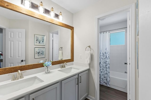1008 Twin Terrace Ct, Round Rock, TX 78665 - full bathroom with double vanity, wood finished floors, and shower / tub combo with curtain