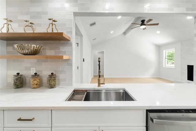 913 Spring Tree St, Round Rock, TX 78681 - kitchen featuring stainless steel dishwasher, a sink, decorative backsplash, open shelves, and white cabinetry