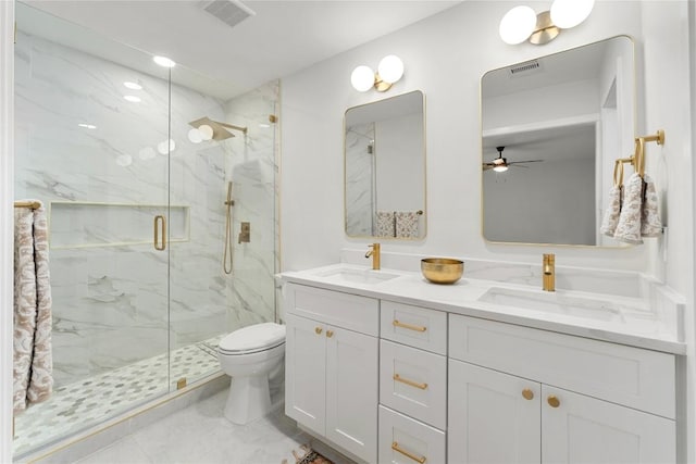 913 Spring Tree St, Round Rock, TX 78681 - full bathroom with a marble finish shower, toilet, double vanity, and ceiling fan