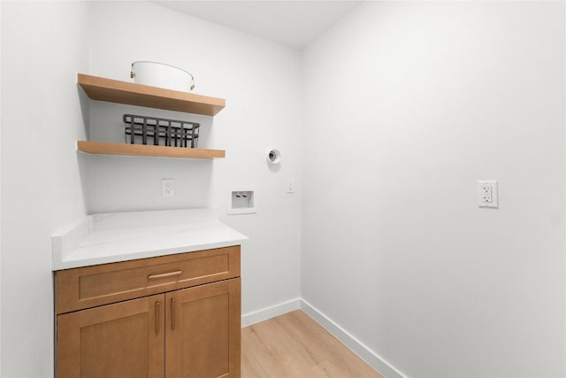 913 Spring Tree St, Round Rock, TX 78681 - laundry area featuring light wood-type flooring, washer hookup, and baseboards