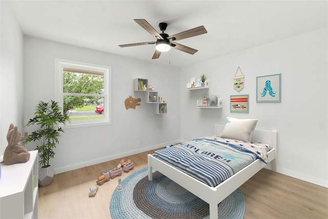 913 Spring Tree St, Round Rock, TX 78681 - bedroom with wood finished floors, baseboards, and ceiling fan