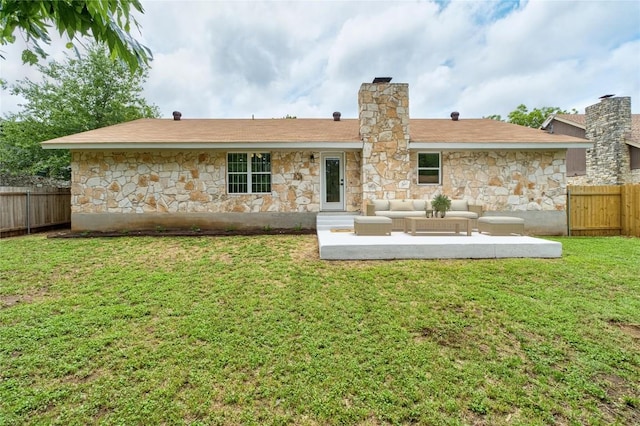913 Spring Tree St, Round Rock, TX 78681 - rear view of property featuring stone siding, an outdoor hangout area, a patio area, and a chimney