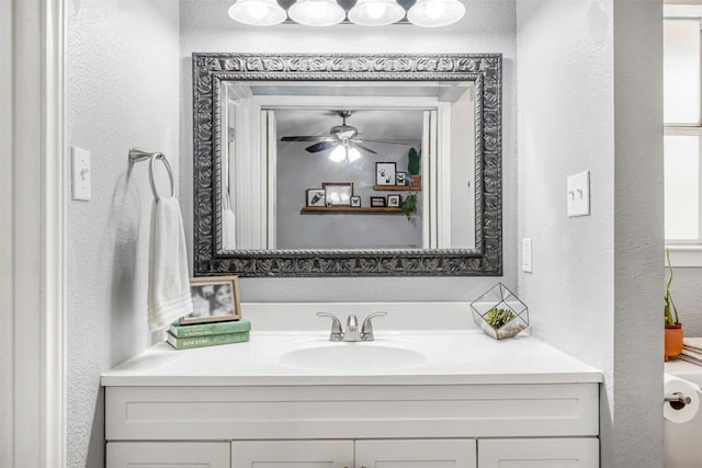1906 Garden Villa Dr, Georgetown, TX 78628 - bathroom featuring a textured wall, vanity, and ceiling fan