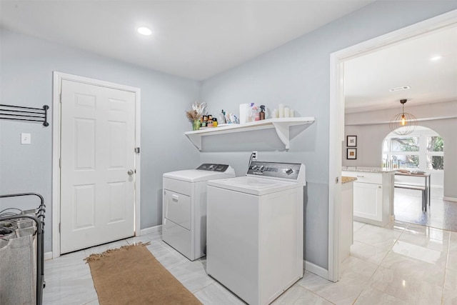 1906 Garden Villa Dr, Georgetown, TX 78628 - washroom with separate washer and dryer and recessed lighting