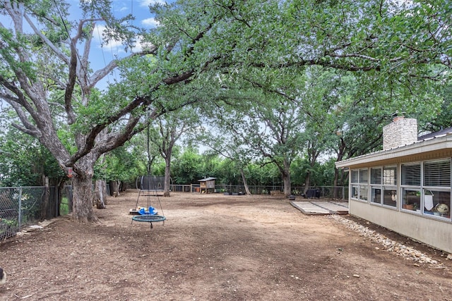 1906 Garden Villa Dr, Georgetown, TX 78628 - fenced backyard with a trampoline