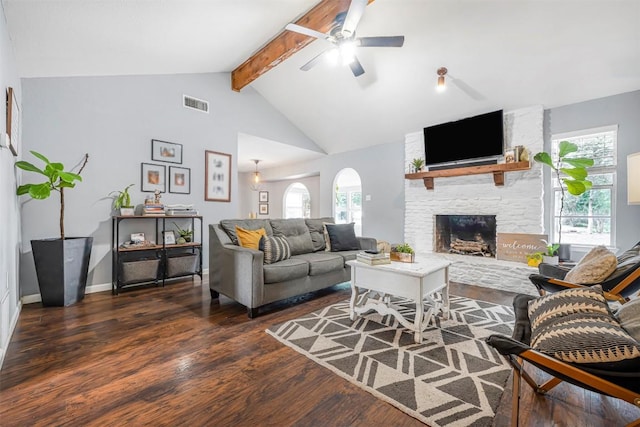 1906 Garden Villa Dr, Georgetown, TX 78628 - living area with beam ceiling, wood finished floors, a ceiling fan, a stone fireplace, and high vaulted ceiling