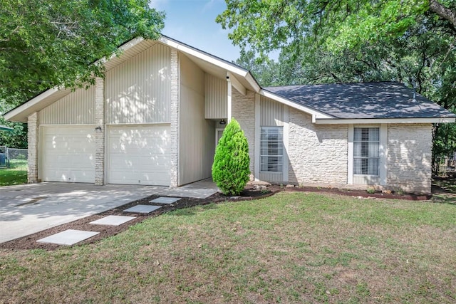 1906 Garden Villa Dr, Georgetown, TX 78628 - mid-century inspired home featuring a garage, driveway, stone siding, and a shingled roof