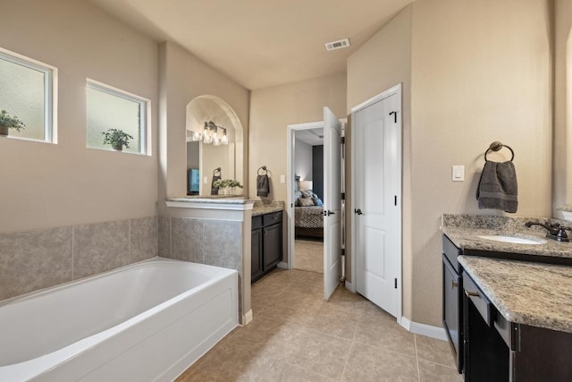2644 Salorn Way, Round Rock, TX 78681 - ensuite bathroom with a garden tub, vanity, and tile patterned floors