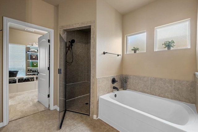 2644 Salorn Way, Round Rock, TX 78681 - bathroom featuring a garden tub, a tile shower, and tile patterned flooring