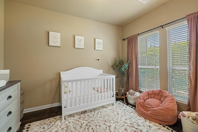 2644 Salorn Way, Round Rock, TX 78681 - bedroom featuring wood finished floors and a nursery area