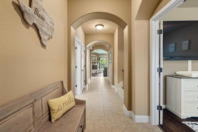 2644 Salorn Way, Round Rock, TX 78681 - hallway featuring arched walkways and tile patterned flooring