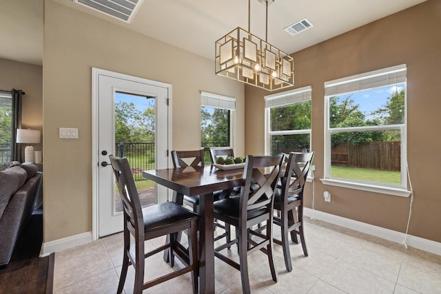 2644 Salorn Way, Round Rock, TX 78681 - dining space with plenty of natural light, light tile patterned floors, and a chandelier