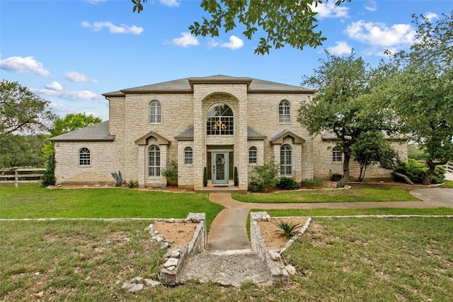 1026 Windmill Rd, Dripping Springs, TX 78620 - french country style house featuring stone siding