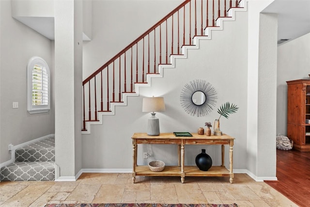 1026 Windmill Rd, Dripping Springs, TX 78620 - staircase with stone tile floors and baseboards