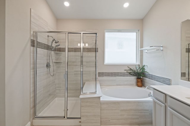 1116 Highwater Dr, Georgetown, TX 78628 - bathroom with vanity, a bath, a shower stall, and recessed lighting
