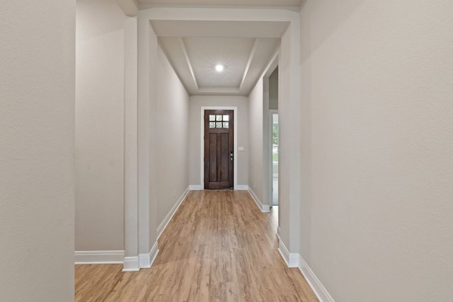 1116 Highwater Dr, Georgetown, TX 78628 - doorway with light wood-style flooring, baseboards, and a raised ceiling