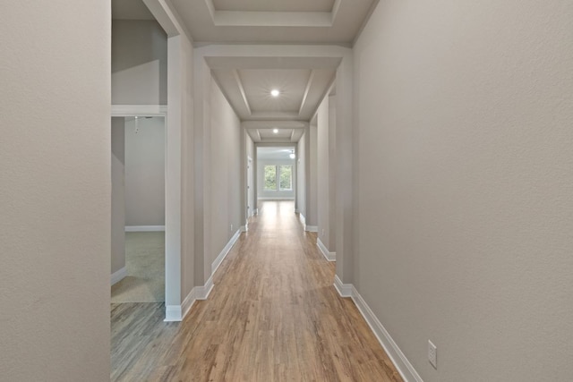 1116 Highwater Dr, Georgetown, TX 78628 - hall featuring wood finished floors, baseboards, a tray ceiling, and recessed lighting