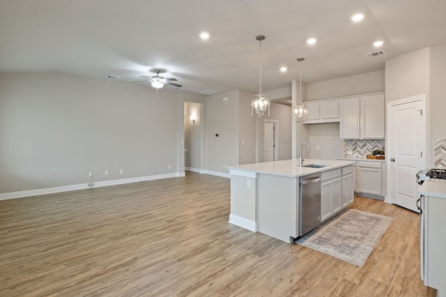 1116 Highwater Dr, Georgetown, TX 78628 - kitchen featuring stainless steel dishwasher, a ceiling fan, recessed lighting, tasteful backsplash, and light countertops
