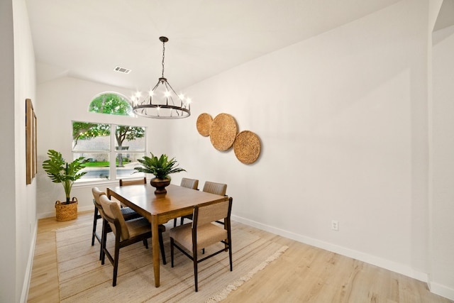 3000 Warwick Way, Austin, TX 78748 - dining space featuring a chandelier, light wood-style flooring, and lofted ceiling