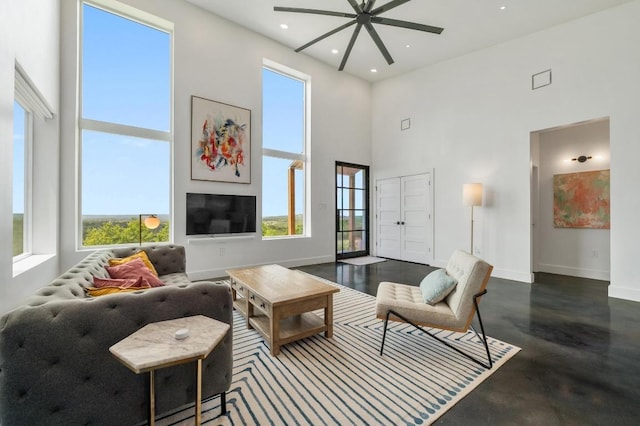 2300 Stagecoach Ranch Loop Unit B, Dripping Springs, TX 78620 - living room with a towering ceiling, a ceiling fan, baseboards, and recessed lighting