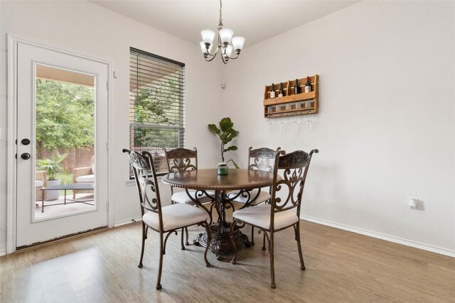 9003 Acorn Cup Dr Unit 34, Austin, TX 78748 - dining space featuring a chandelier, light wood-style floors, and baseboards