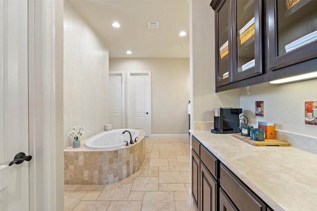303 Bella Montagna Cir, Austin, TX 78734 - full bath with stone tile flooring, a bath, recessed lighting, and vanity