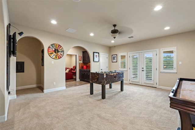 303 Bella Montagna Cir, Austin, TX 78734 - recreation room featuring a ceiling fan, arched walkways, light carpet, french doors, and recessed lighting