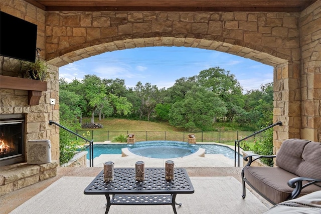 303 Bella Montagna Cir, Austin, TX 78734 - view of swimming pool with an outdoor stone fireplace and a patio area