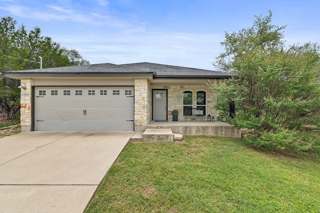 21003 Dodge Trl, Lago Vista, TX 78645 - view of front of home with driveway, a porch, an attached garage, stone siding, and a front yard