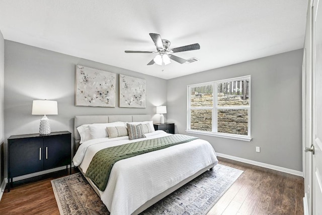 21003 Dodge Trl, Lago Vista, TX 78645 - bedroom featuring dark wood-type flooring and a ceiling fan