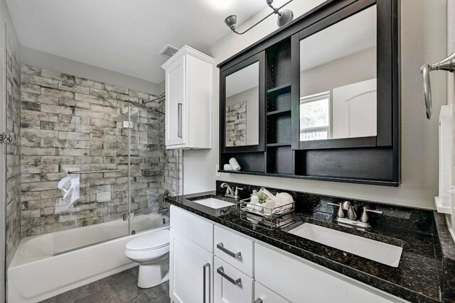 21003 Dodge Trl, Lago Vista, TX 78645 - full bathroom with double vanity and bath / shower combo with glass door