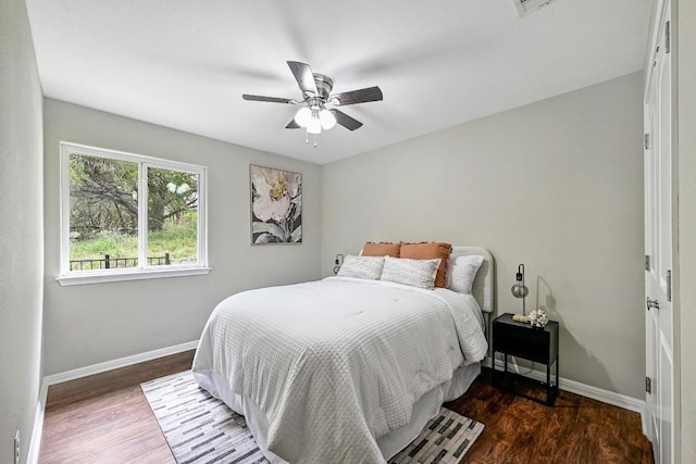 21003 Dodge Trl, Lago Vista, TX 78645 - bedroom featuring wood finished floors and a ceiling fan