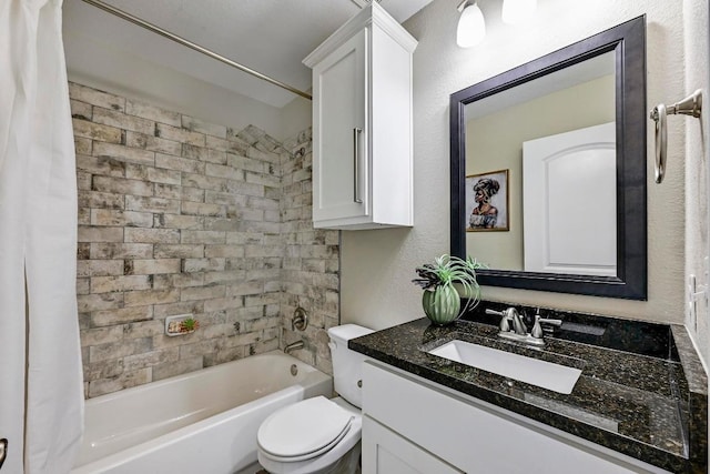 21003 Dodge Trl, Lago Vista, TX 78645 - bathroom featuring vanity, shower / bath combo with shower curtain, and a textured wall