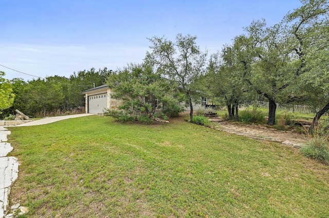 21003 Dodge Trl, Lago Vista, TX 78645 - view of grassy yard with concrete driveway and an attached garage