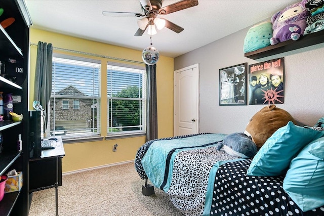 257 Culebra Dr, Georgetown, TX 78626 - carpeted bedroom with baseboards and ceiling fan