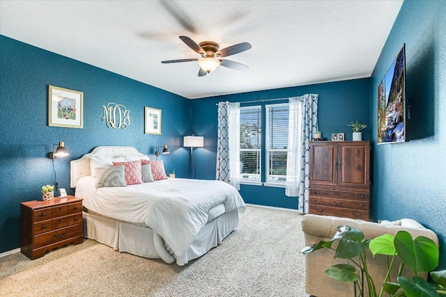 257 Culebra Dr, Georgetown, TX 78626 - bedroom with carpet flooring, baseboards, a ceiling fan, a textured wall, and a textured ceiling
