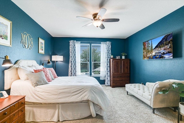 257 Culebra Dr, Georgetown, TX 78626 - bedroom with carpet floors, a textured wall, a ceiling fan, and a textured ceiling