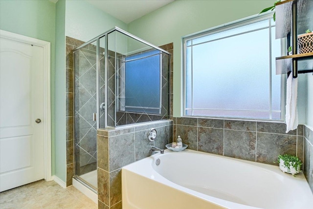 257 Culebra Dr, Georgetown, TX 78626 - full bath with a garden tub, a stall shower, and tile patterned flooring