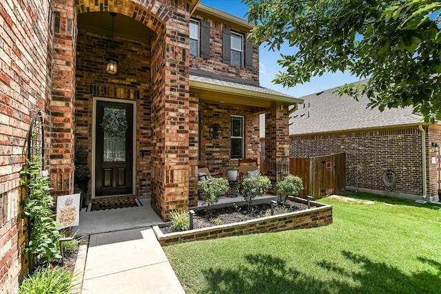 257 Culebra Dr, Georgetown, TX 78626 - view of exterior entry featuring brick siding and a porch