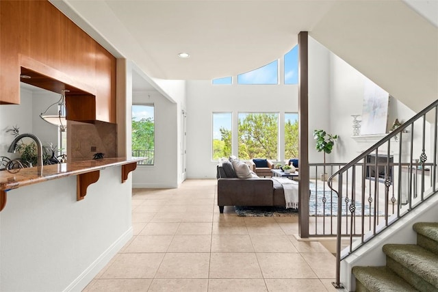 8546 Adirondack Trl Unit 14, Austin, TX 78759 - living room with stairs, light tile patterned flooring, and recessed lighting