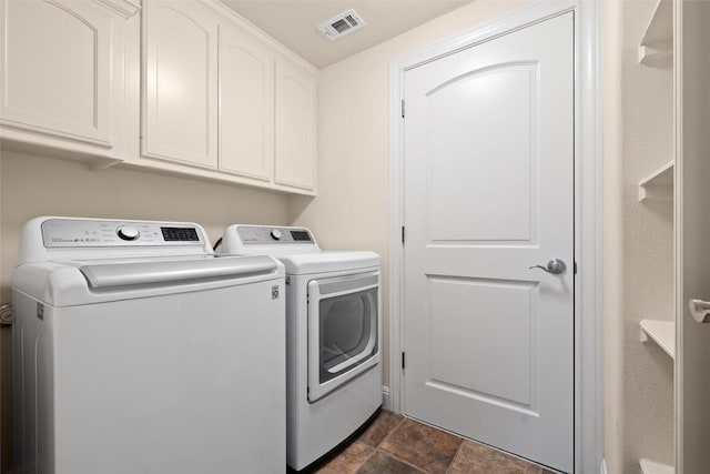 8546 Adirondack Trl Unit 14, Austin, TX 78759 - laundry room featuring washer and dryer, cabinet space, and dark stone finish flooring