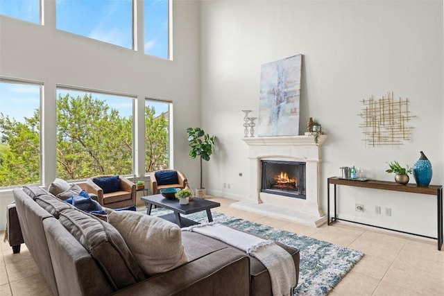8546 Adirondack Trl Unit 14, Austin, TX 78759 - tiled living room with a high ceiling and a high end fireplace