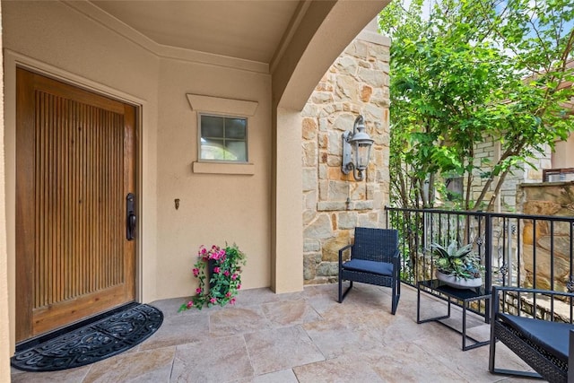 8546 Adirondack Trl Unit 14, Austin, TX 78759 - doorway to property with stone siding and stucco siding