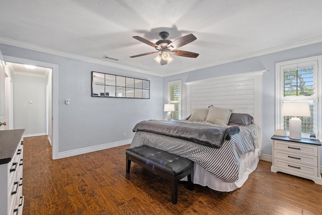 13201 Stillforest St, Austin, TX 78729 - bedroom featuring multiple windows, dark wood-style floors, crown molding, and baseboards