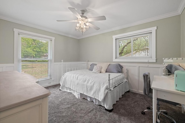 13201 Stillforest St, Austin, TX 78729 - bedroom featuring dark colored carpet, crown molding, a decorative wall, wainscoting, and a ceiling fan